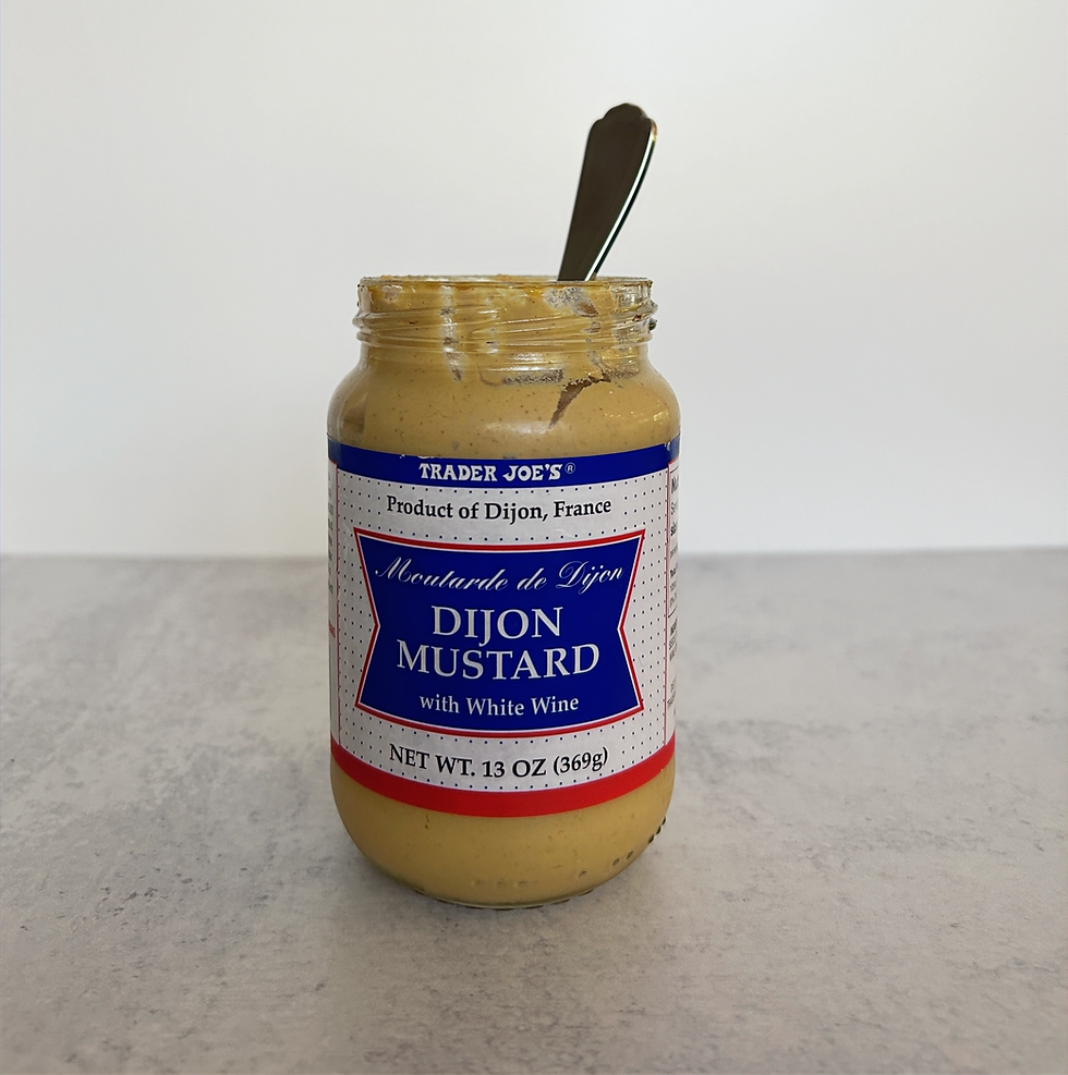 Dijon mustard, a pantry staple, can be found in most supermarkets. It is known for its smooth texture and distinct flavor, making it a popular choice for various culinary applications.