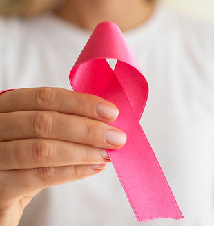 close-up-woman-holding-up-awareness-ribbon.jpg