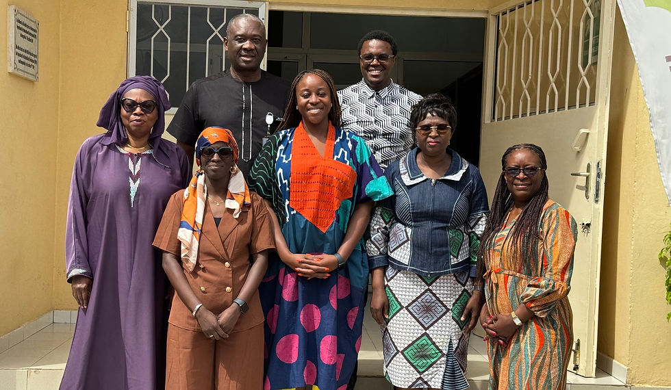 Group of people, mostly women, pose for a photo after the session.