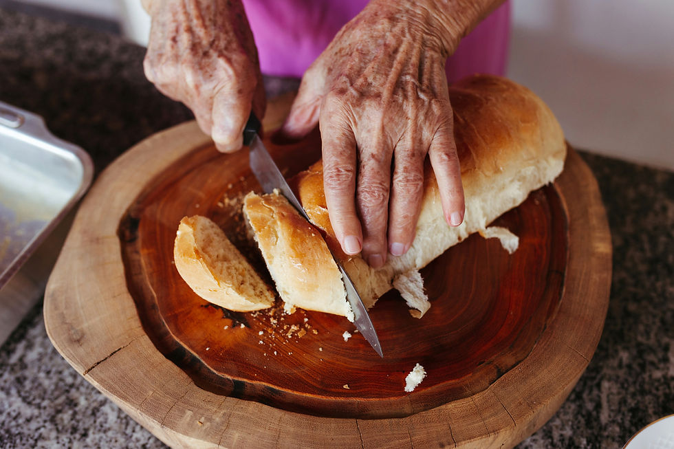 A home made loaf of bread being sliced