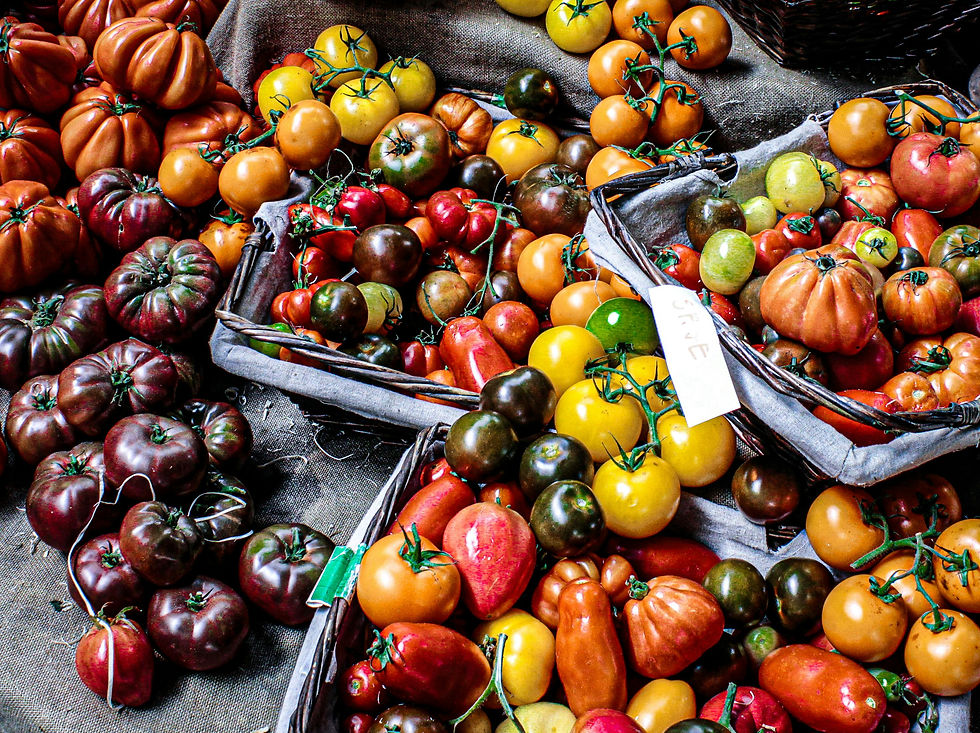 Colorful array of tomatoes on market stall