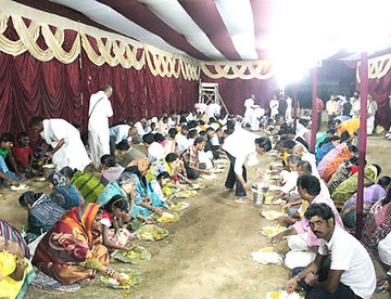 Prasadam distribution to devotees.