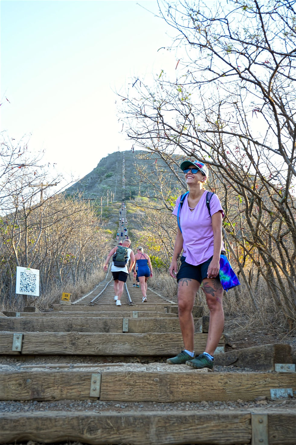 Kristina Budaj, gears up for the challenge ahead on the KoKo Head trail, with a steep path and clear blue sky in view. Photo by Robert Moore.