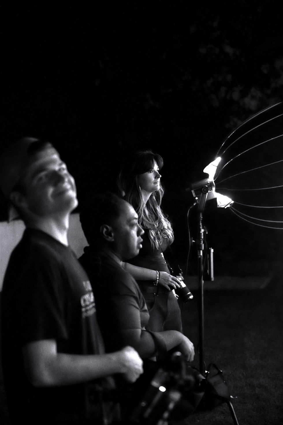 The crew of STAINED, captured in a candid moment, navigates the dynamic landscape of Oahu's film industry, embracing collective storytelling. Photographed by Robert Moore of RM PHOTOGRAPHY & FILM in Honolulu, Hawaii.