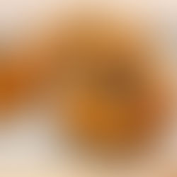 Lentil and mushroom filled crescent cups on a beige plate, set on a light wooden surface. The cups are golden brown, creating a warm, inviting mood.