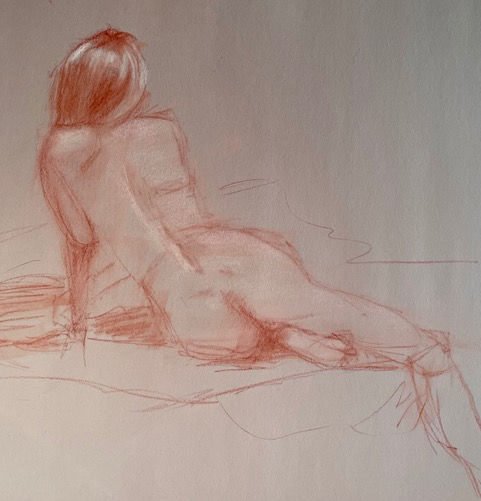 Figure drawing of a woman laying down.