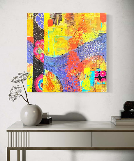 Bold, colorful abstract painting with floral patterns, dotted textures, and sweeping shapes in pinks, yellows, and purples on a wall.