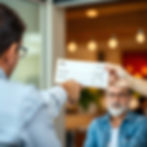 Handing cheque to other person.jpg