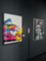 Pop art paintings by a contemporary artist in a gallery.