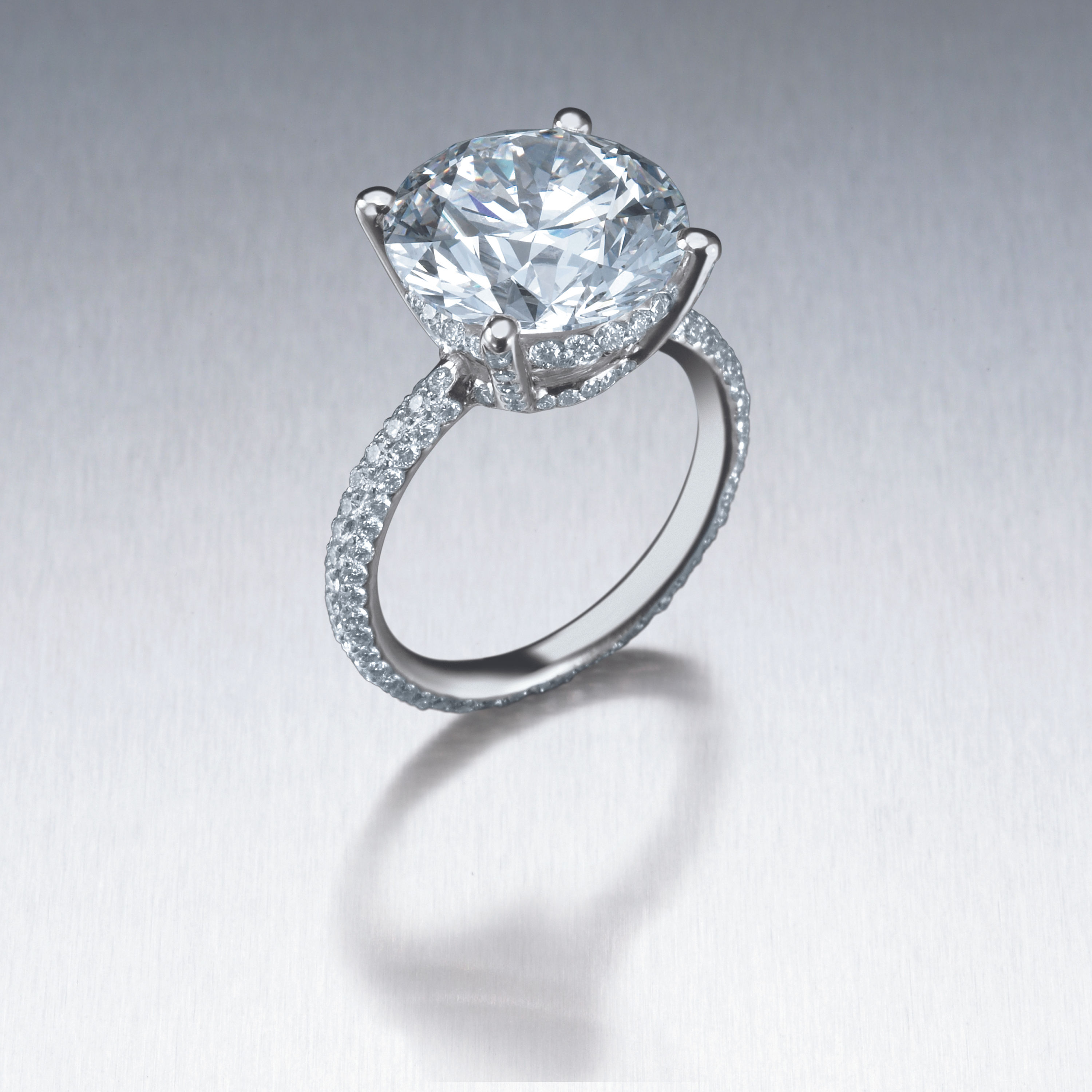 4-prong Solitaire with 3-row pave band