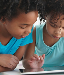 Two Friends with a Tablet