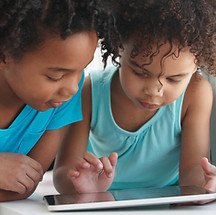 Two Friends with a Tablet
