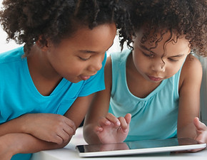 Two Friends with a Tablet