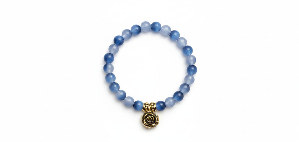 A classic stretch bracelet made with round, blue lace agate gemstone beads, featuring a detailed, antique-gold rose charm, on a solid white background.