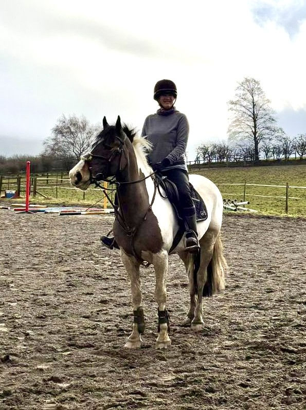 Vicky Tucker artist riding her horse Sabrina.