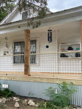 Final inspection of completed porch remodel with homeowner.
