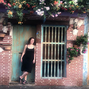 Letra Caribe student poses in a doorway in Cartagena.