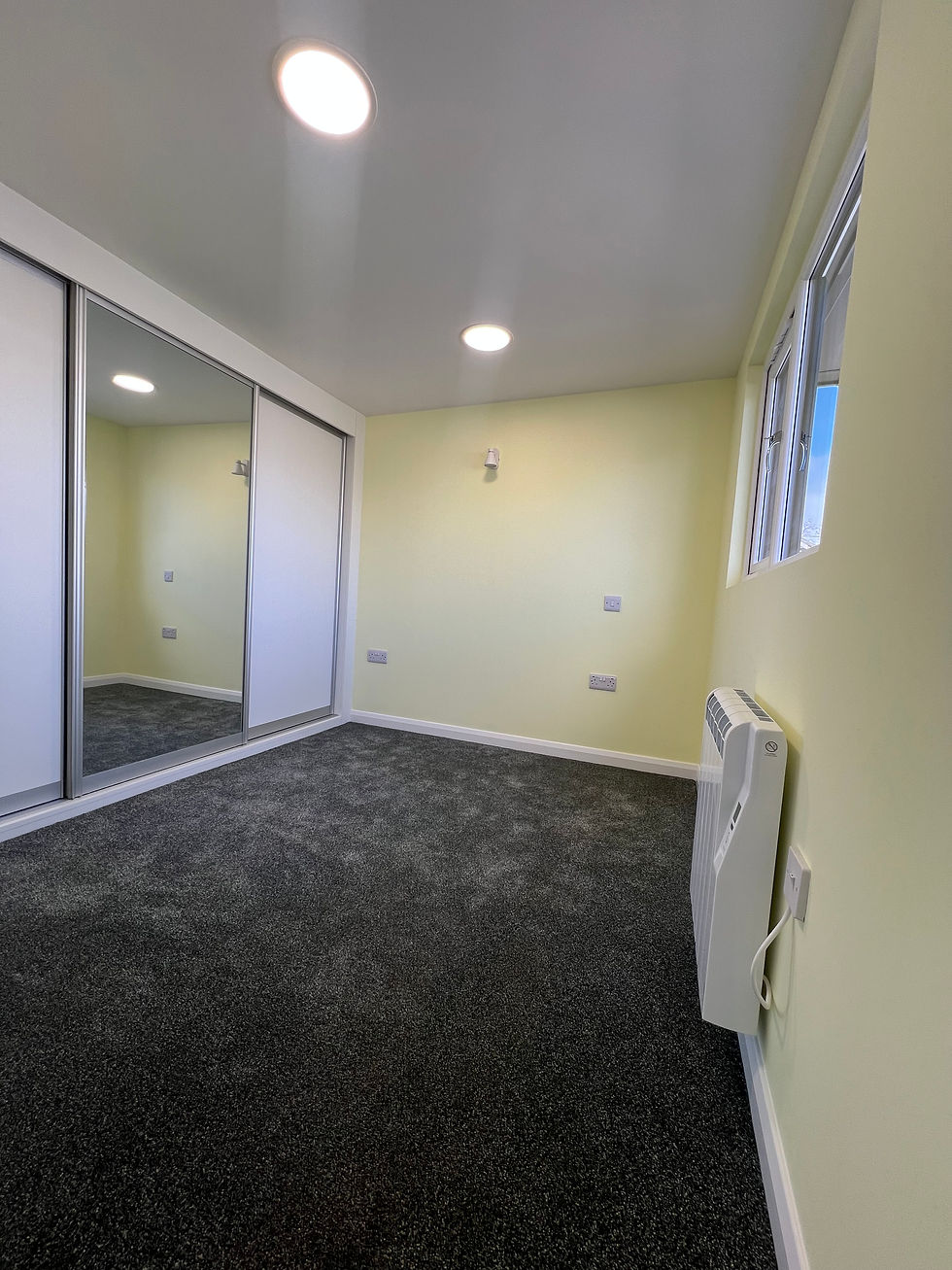 Bedroom With Large Window & Fully Fitted Wardrobes