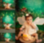 Toddler with fairy wings enjoys a cake in a whimsical forest-themed setting, surrounded by greenery and fairy lights, showing delight as photographed by Tiffany Edwards, Cake Smash and First Birthday Session Photographer in Billings, Montana.