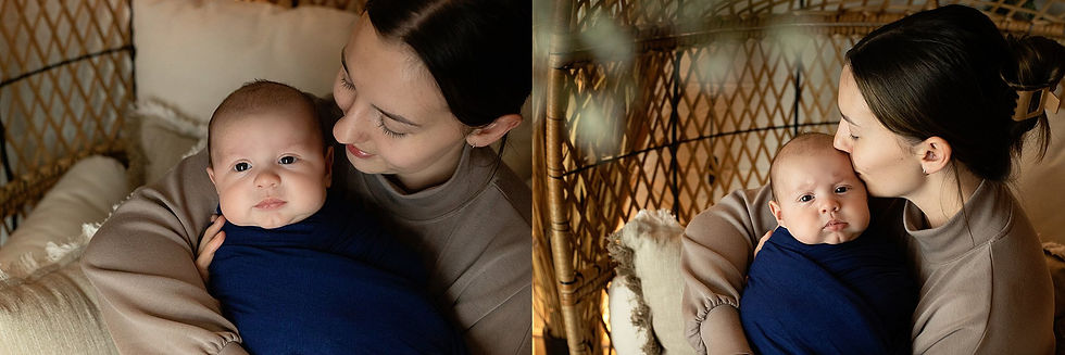 Woman cuddling and kissing a baby swaddled in navy blue, sitting in a cozy wicker chair with pillows, warm and intimate atmosphere as photographed by Tiffany Edwards, Newborn and Childhood Photographer in Billings Montana