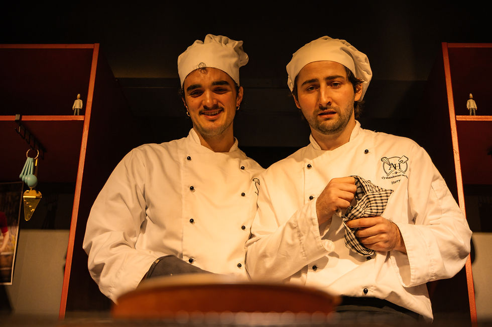 Alfred Kouris and Harry Stacey bake a cake