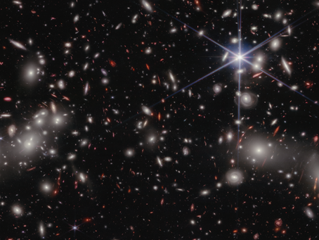 Ben Gurion Universiteit: Astronomen detecteren een extreem rood superzwaar zwart gat in het vroege heelal dat in de schaduw groeit