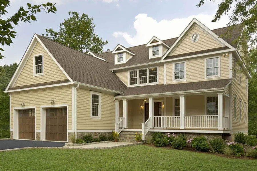 Custom-designed residential modular home with a wrap-around driveway in New England.