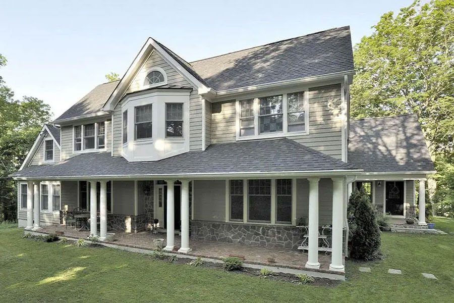 Elegant custom modular house exterior featuring a classic American front porch design.