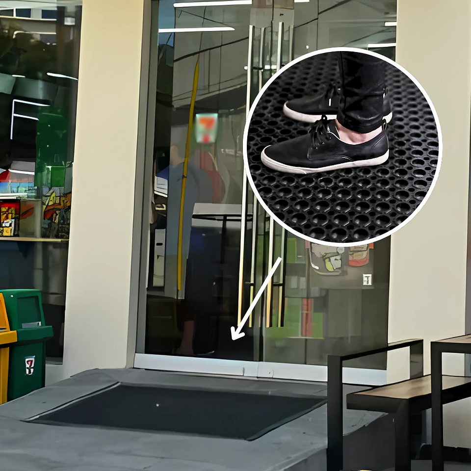 Zoomed-in view of heavy foot traffic over a durable kitchen mat placed at the entrance of a commercial space, highlighting the mat’s textured surface designed to trap dirt and provide slip resistance