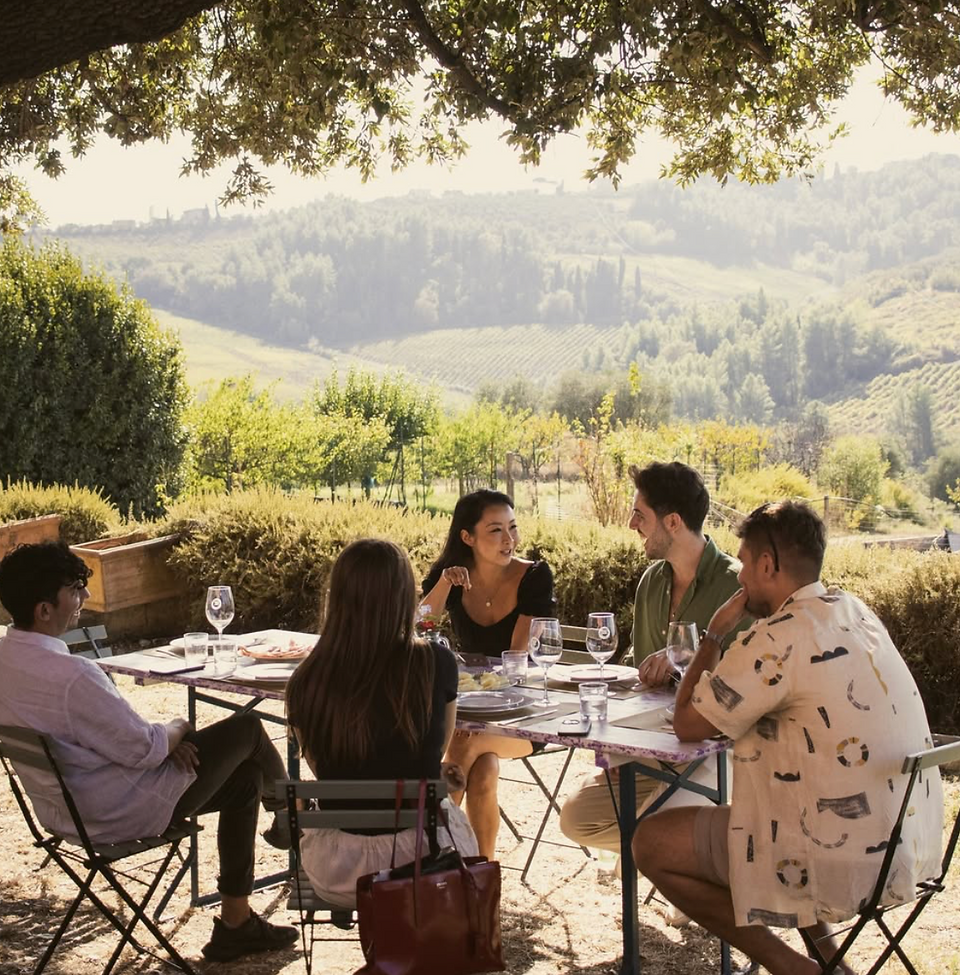 Lunch with friends in Tuscany over the hills. In a luxury retreat destination from Nomad Home