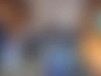 People in hall way filling out forms