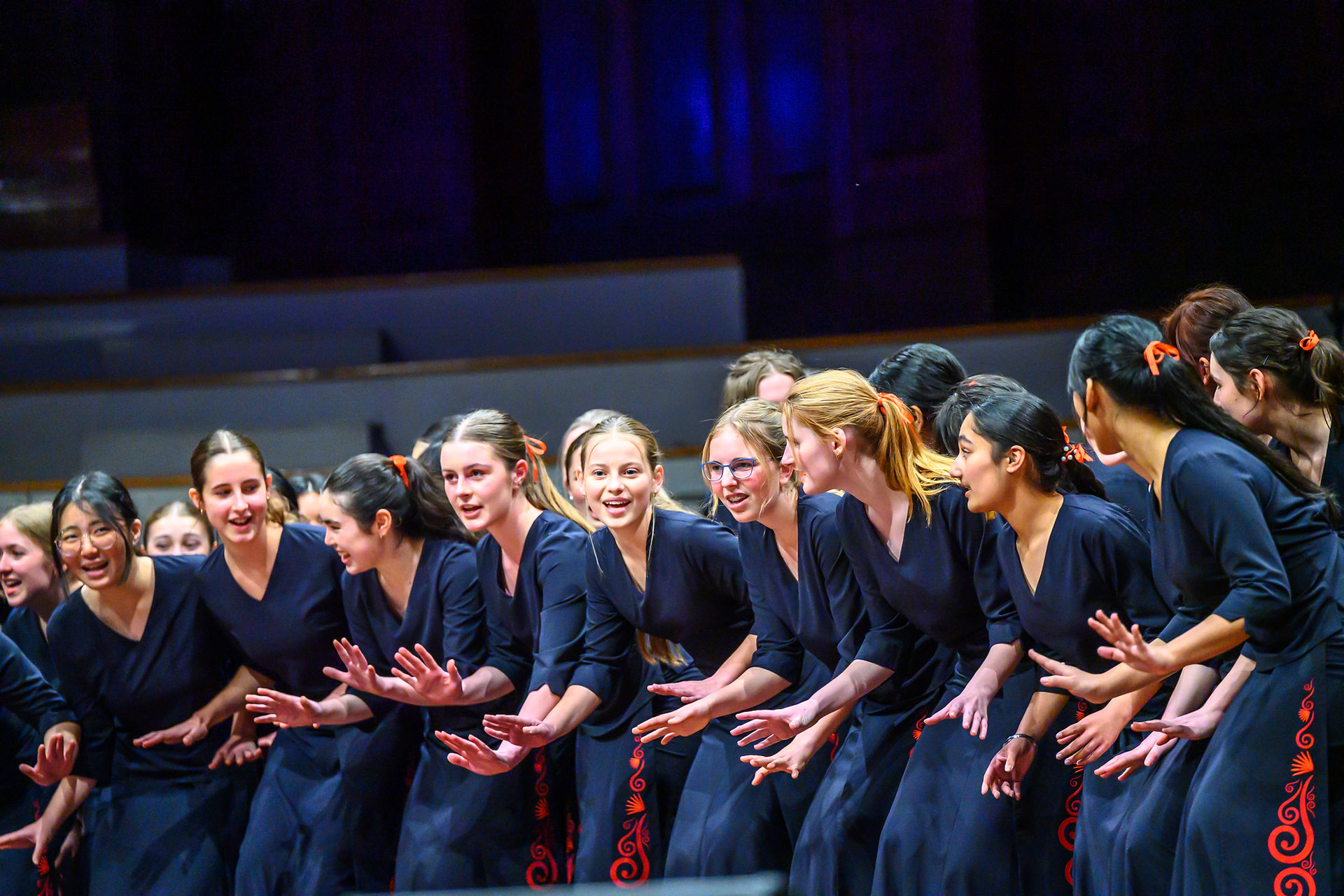 Young girls singing and performing on state