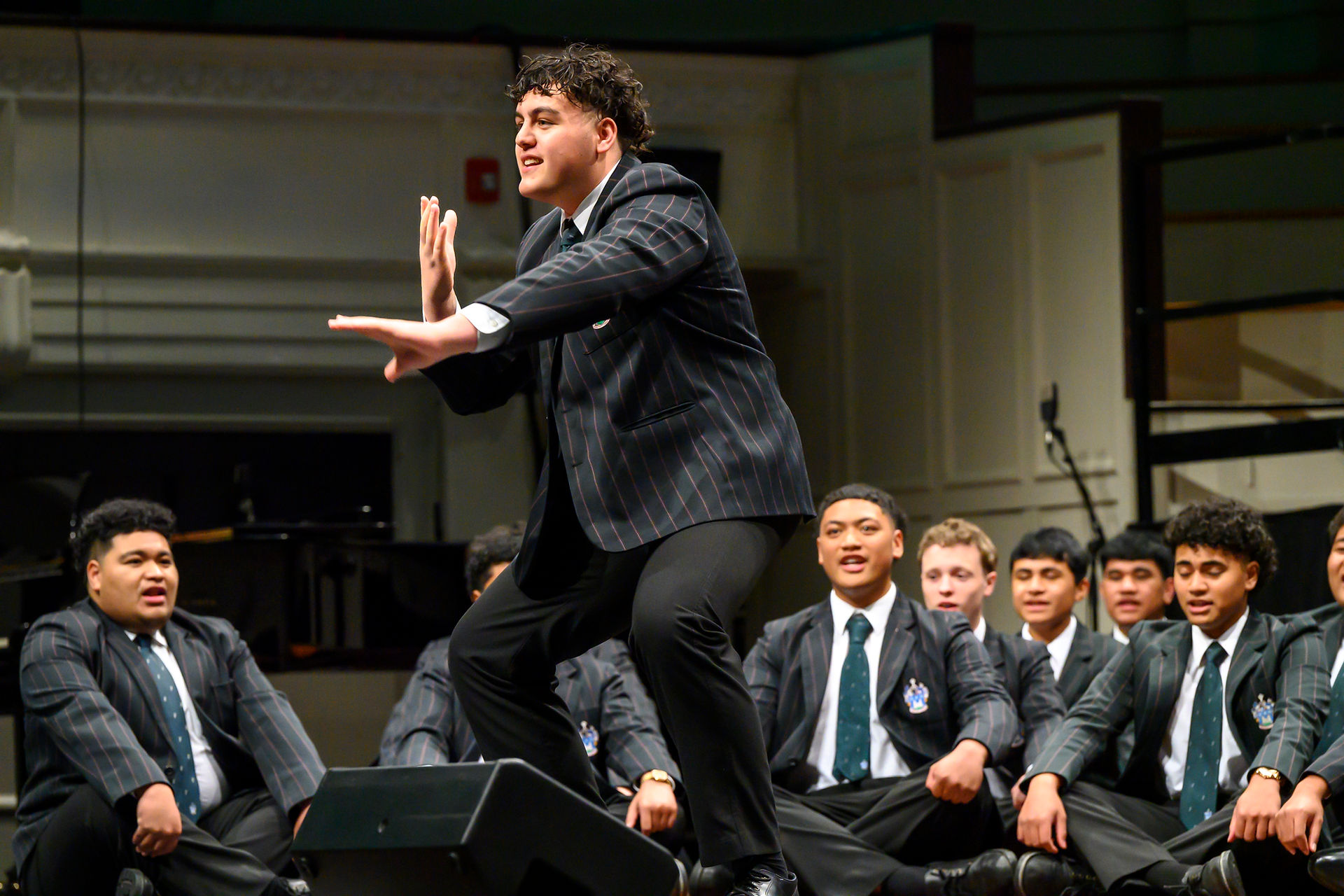 Young males performing in school uniform