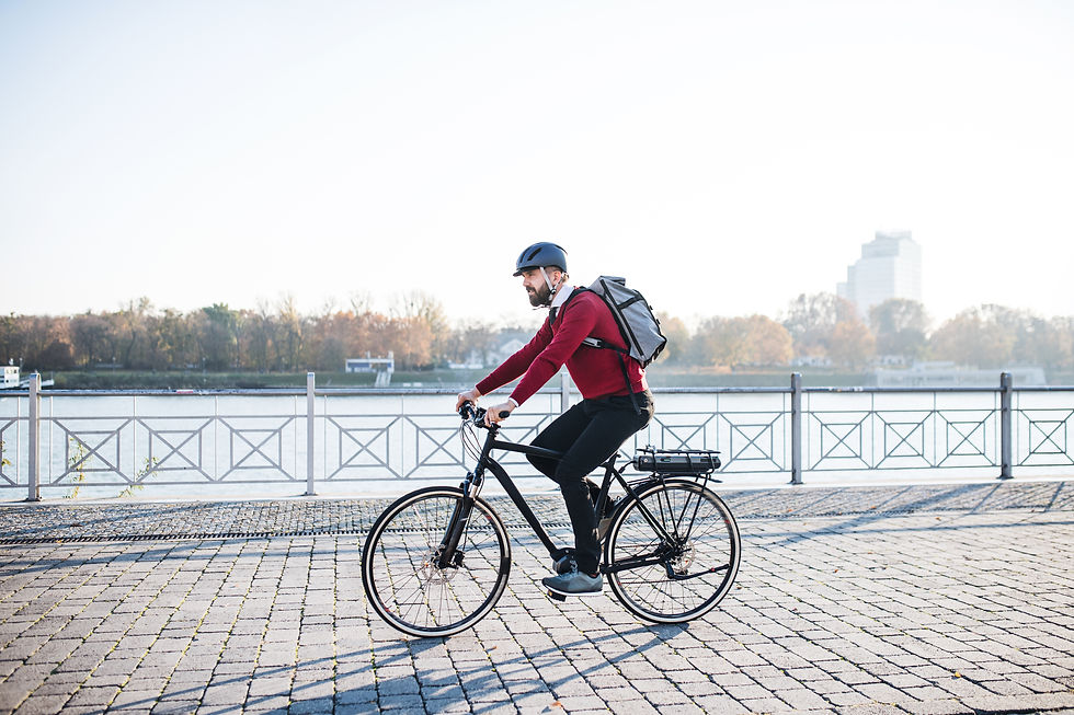 Hipster businessman commuter with electric bicycle traveling to work in city..jpg