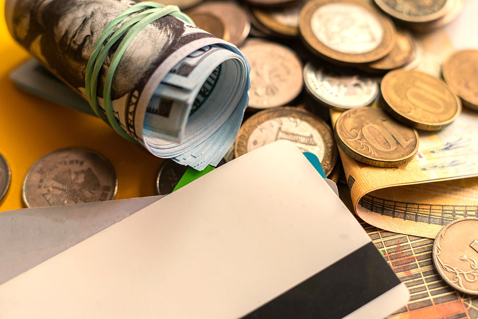 close-up-bunch-of-coins-currency-and-credit-cards-2025-01-27-04-05-51-utc.jpg