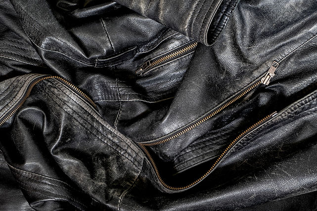 Black_worn_leather_jacket_detail_1-2000.jpg