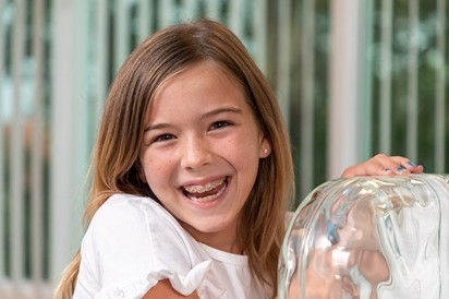 Smiling girl with braces