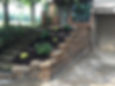kings wall retaining wall, mulch, and plantings