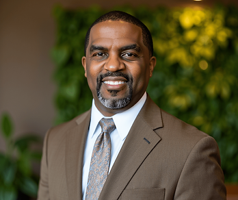 TLPjr Headshot-Brown Suit.png