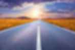 Carefree driving on an empty road at sunset.jpg