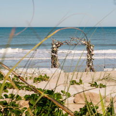 Wedding Arch with ocean as the backdrop, at Harbour House in Indian Harbour Beach, Florida.