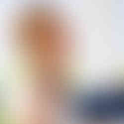 Bride smiling joyfully during the wedding ceremony in a close up portrait