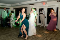 Bride and her mom dancing during wedding reception at Harbour House in florida. Photo by Pixel Groves