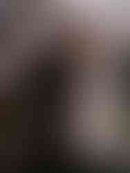 Bride and groom sharing a romantic kiss inside The Ritz-Carlton Orlando Grande Lakes with luxurious interiors