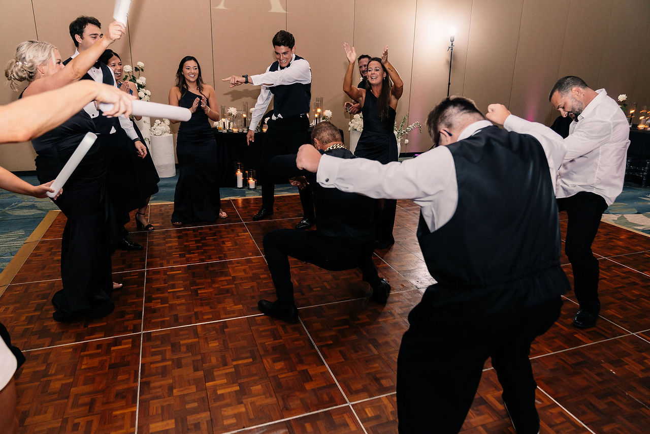 Guests dancing and celebrating on the dance floor at The Ritz-Carlton Orlando Grande Lakes wedding reception