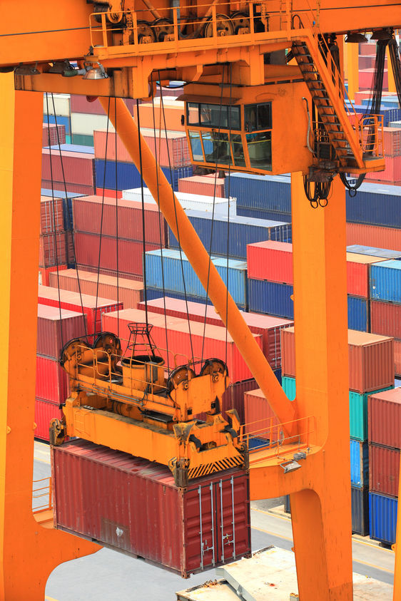 A crane at a port operating for a logistics company