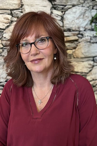 Tracy Teichman, Certified Safe and Sound Protocol practitioner, offering trauma-focused therapy in a peaceful office.