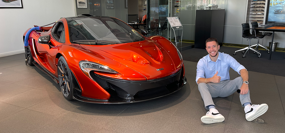 chrisncars sitting next to an orange McLaren P1