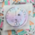 Iridescent sticker envelope from The Bag Makers Sew-Ciety surrounded by woven labels reading “Better Than Store Bought Shit.”