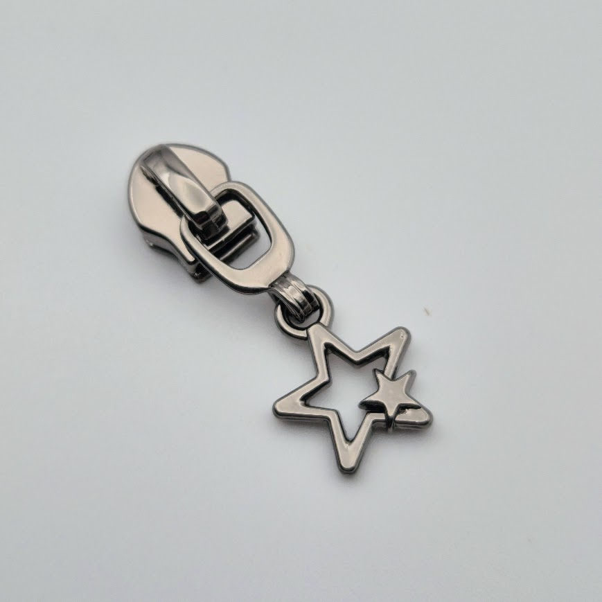 Gunmetal double star zipper pull with a clean, modern finish and layered star design